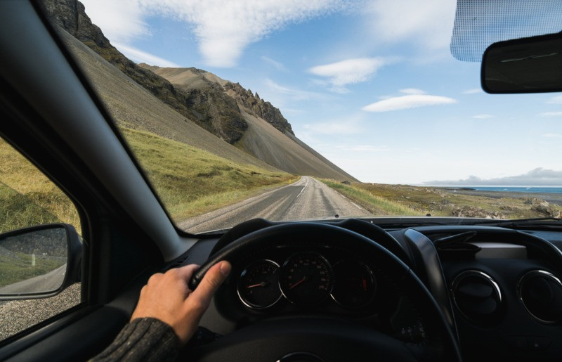 Turist driving through Iceland countryside