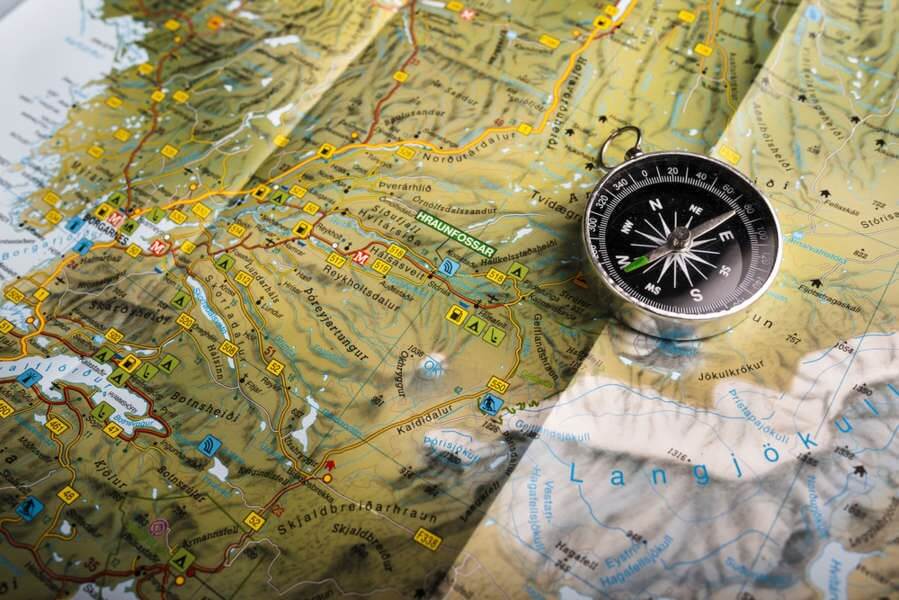 compass on an icelandic map, iceland clockwise or counterclockwise