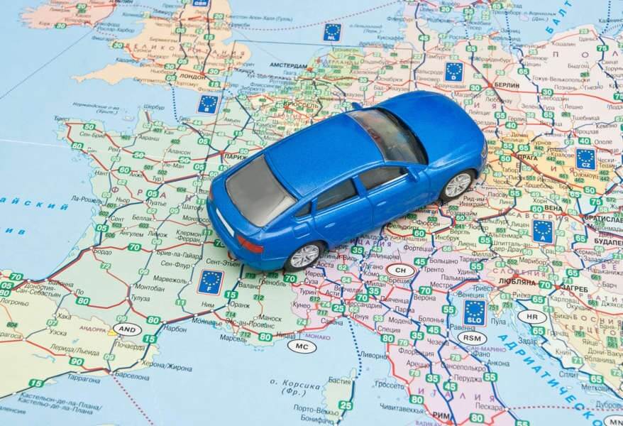 Toy car on a map of Europe - driving in Europe